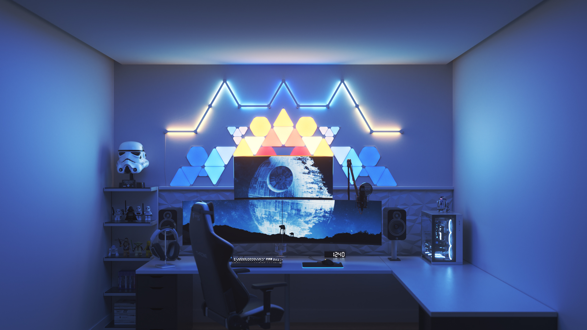 Un espace de jeu au style futuriste avec les panneaux lumineux Nanoleaf Shapes intelligents DEL au-dessus du moniteur. Les meilleurs choix de couleurs de lumières pour vos parties de jeux sur ordinateur.