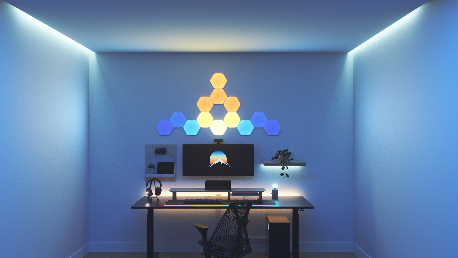 Un espace de jeu au style Kawaii avec les panneaux lumineux Nanoleaf Shapes Hexagone RGB intelligents au-dessus du moniteur de l’ordinateur. Les lumières intelligentes parfaites pour compléter l’esthétique du mordu des jeux.