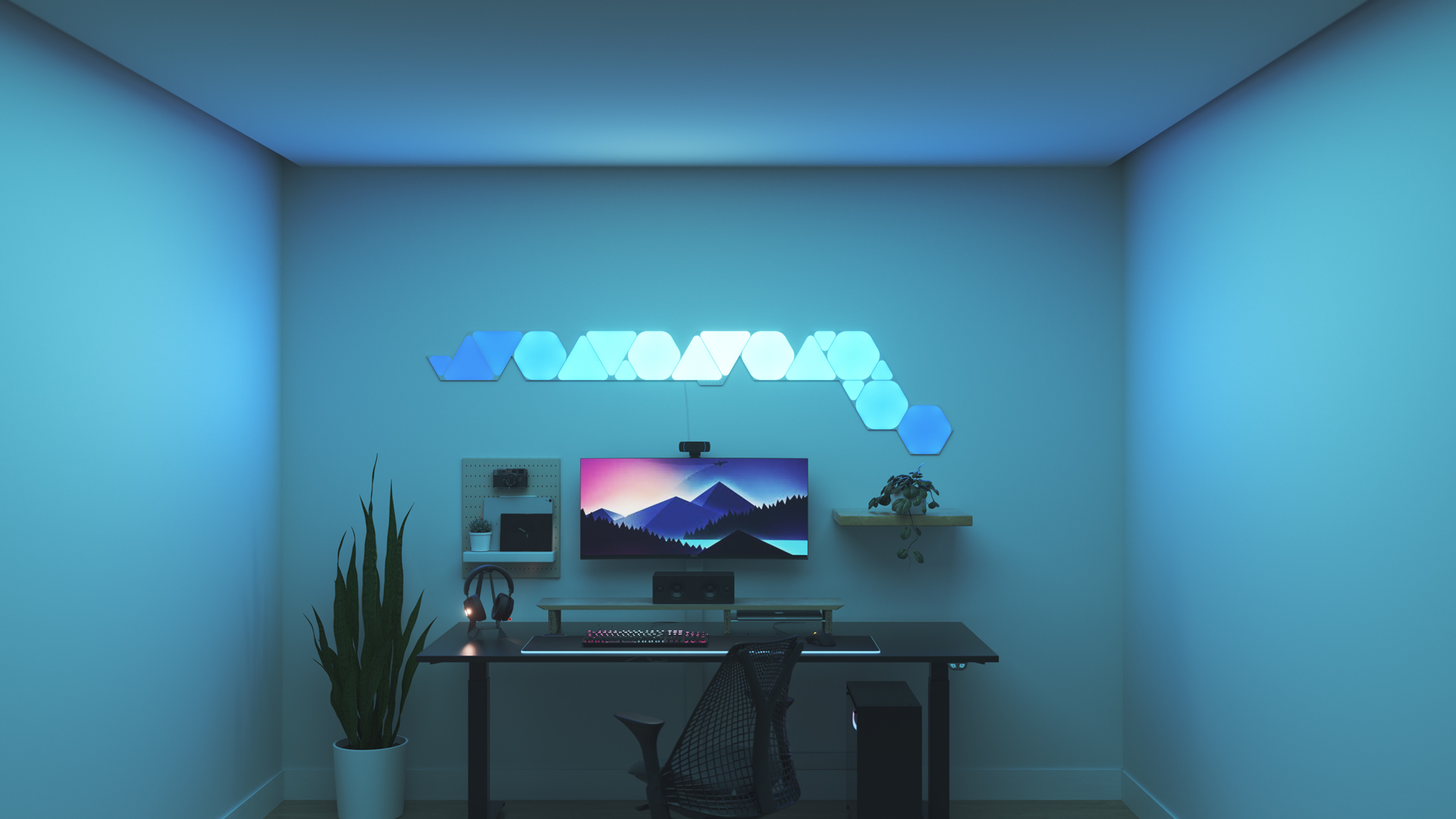 Un espace de jeu au style minimaliste avec les panneaux lumineux Nanoleaf Shapes RGB intelligents au-dessus de votre moniteur. Les jeux sur ordinateur sont meilleurs avec ces jeux de lumière.